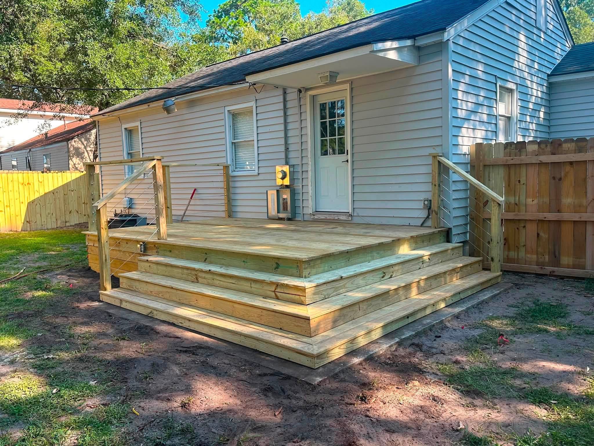 Corner of a deck with wrap-around steps and skirting