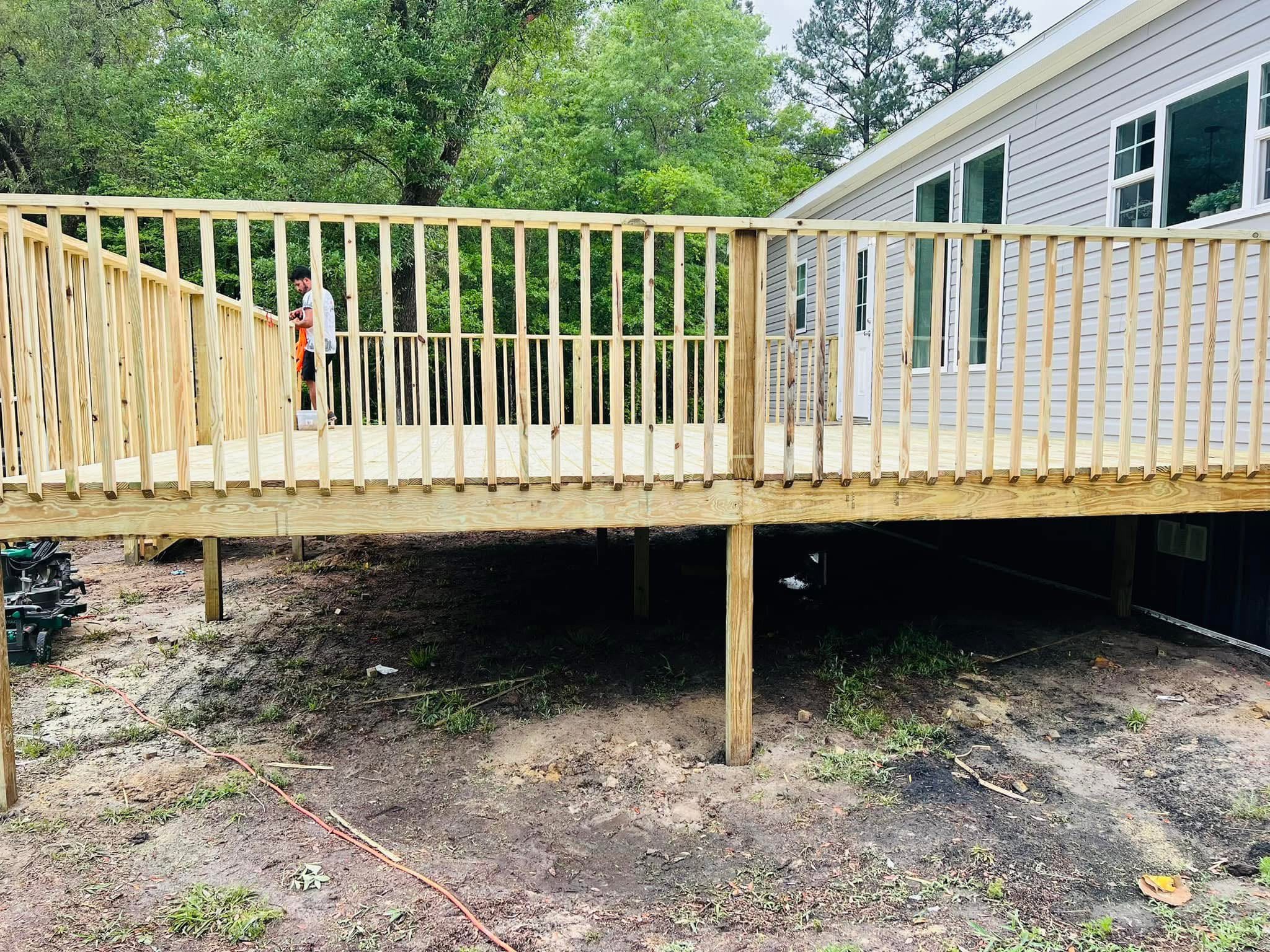 Deck railing going up on a large raised deck