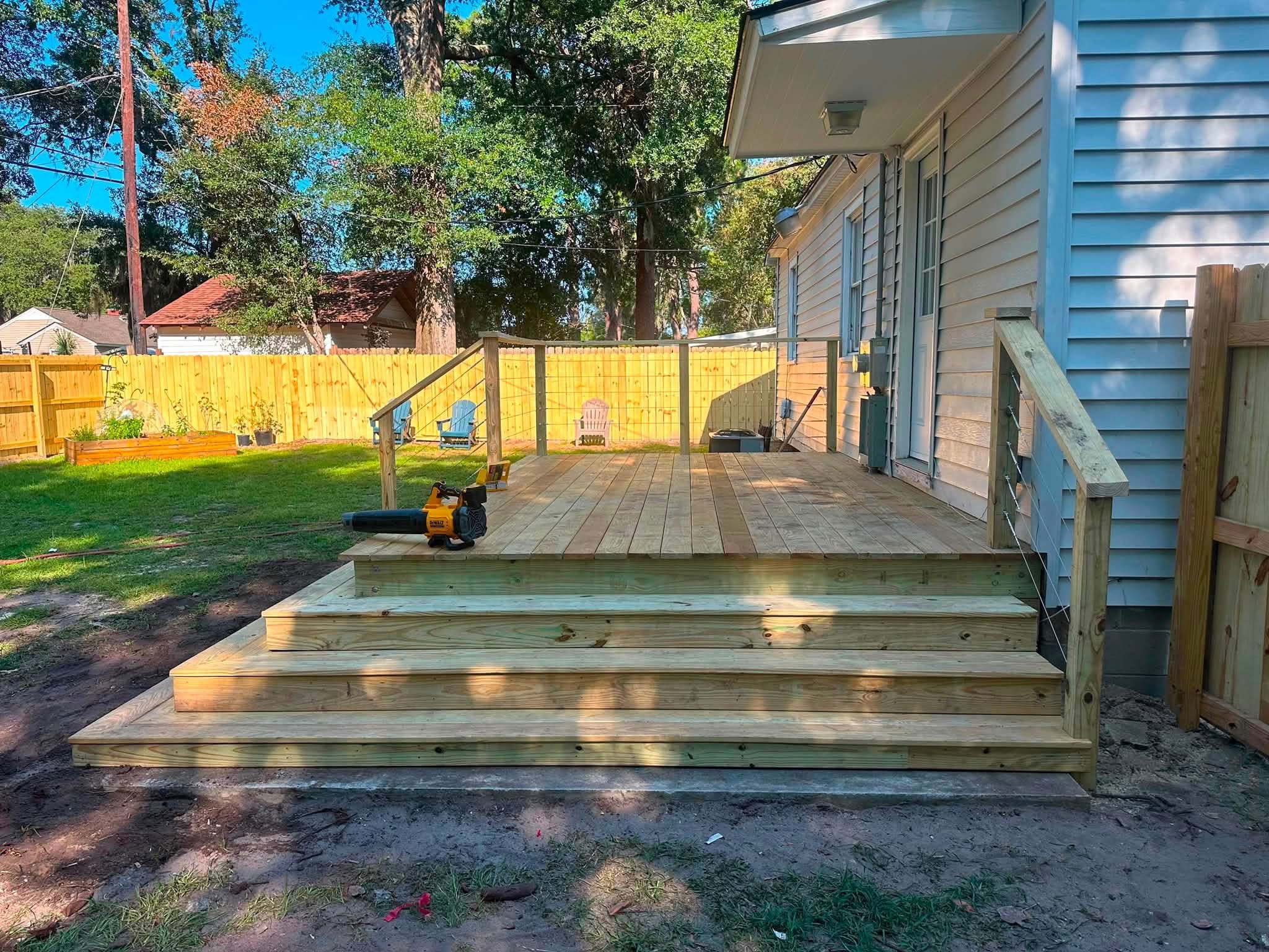 Deck with a full-width step landing down to the yard