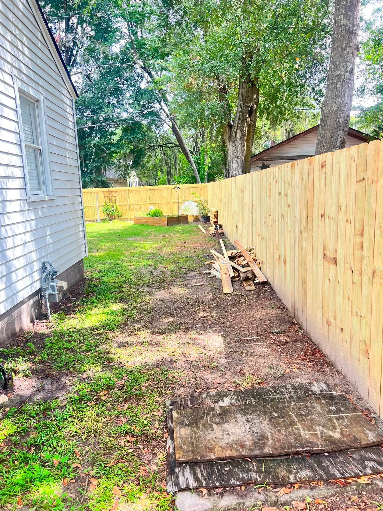 New privacy fence running along a property line