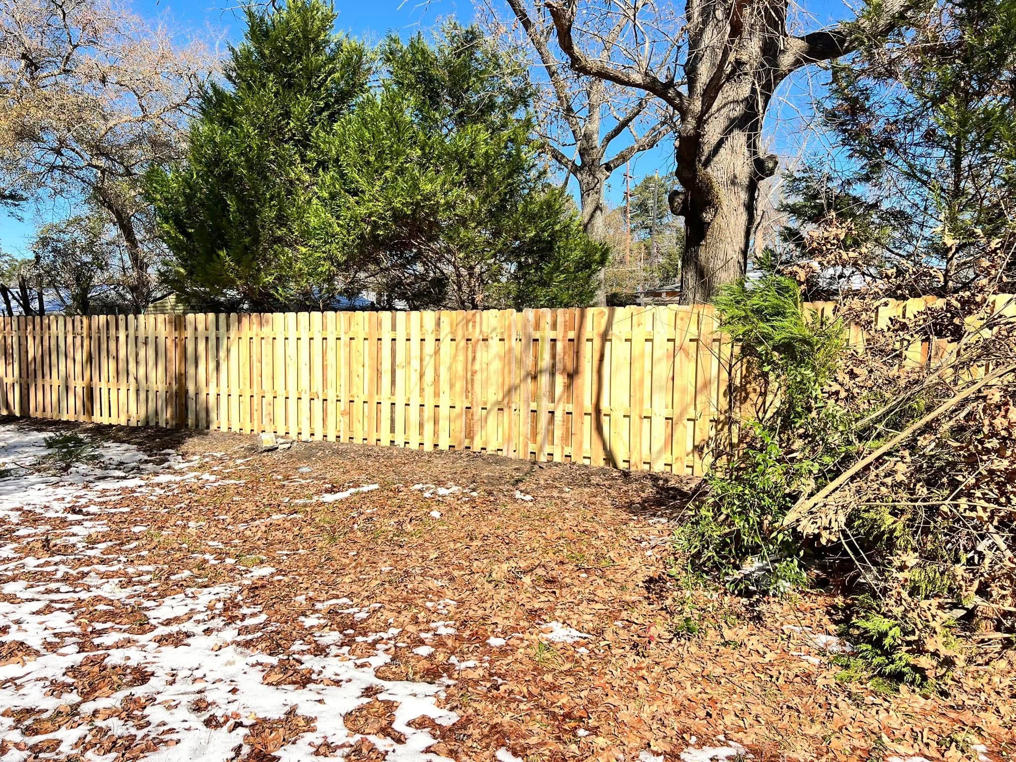 Long shadowbox privacy fence along a property line
