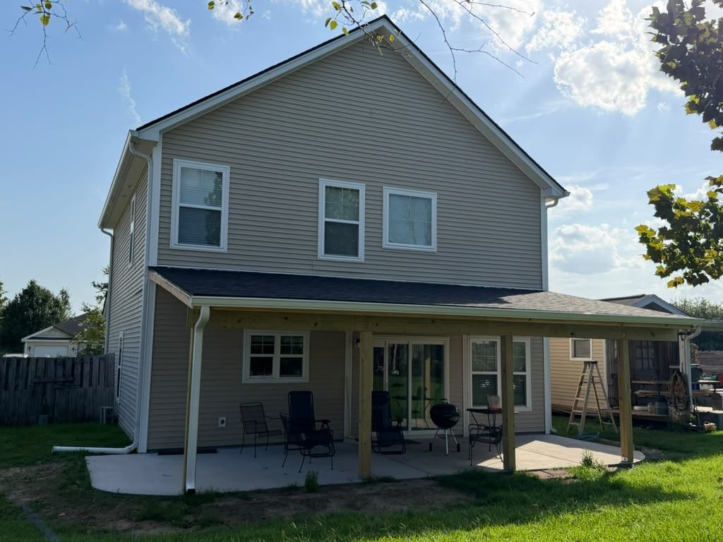Custom porch cover seen from the corner of the backyard