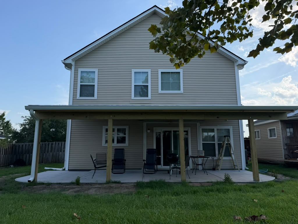 Straight-on view of the finished porch spanning the rear elevation