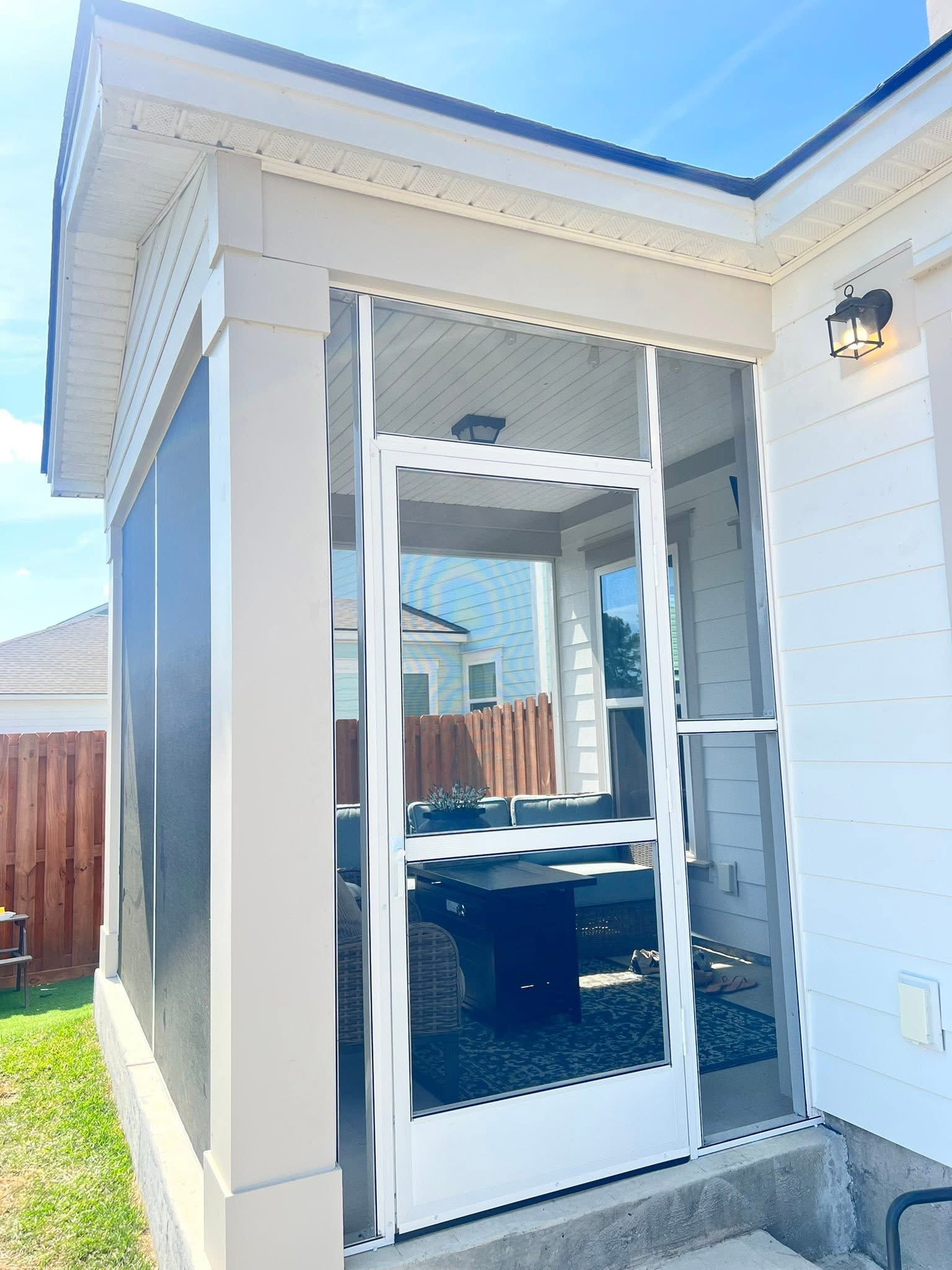 Screened porch entry with a self-closing screen door